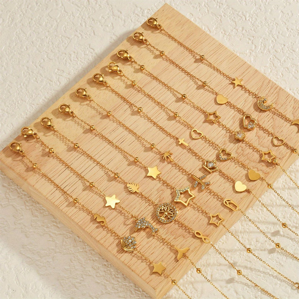 Un nouveau bracelet élégant en acier inoxydable au toucher luxueux, orné de motifs papillon, cœur, couronne et trèfle. Cette pièce unique et tendance constitue un cadeau idéal pour la famille, en particulier pour le Nouvel An.